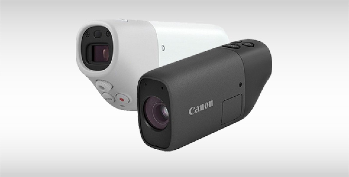 Zwei Canon-Kameramodelle nebeneinander, eines weiß, das andere schwarz, mit Frontobjektiven und Markenlogos.